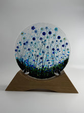 Load image into Gallery viewer, Decorative wall piece with circular design and wooden frame on a white background