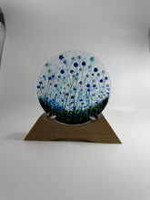 Load image into Gallery viewer, Handmade Fused Glass Round/Disc Blue Flower Ornament in a handmade Oak stand
