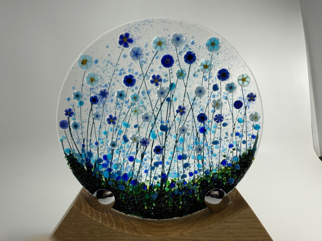 Handmade Fused Glass Round/Disc Blue Flower Ornament in a handmade Oak stand