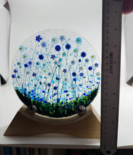 Load image into Gallery viewer, Handmade Fused Glass Round/Disc Blue Flower Ornament in a handmade Oak stand

